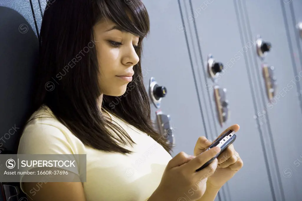 young woman with a handheld video game