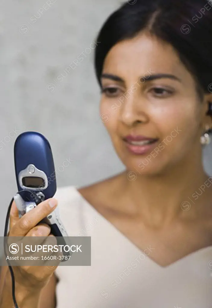 Close-up of a businesswoman looking at a mobile phone