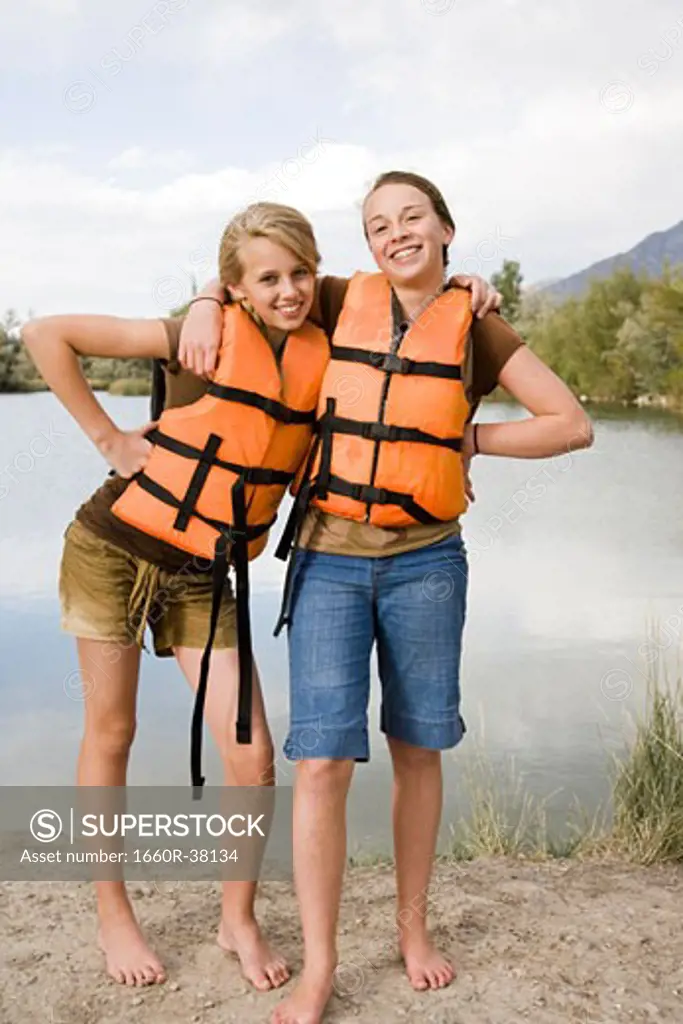 two girls in life vests