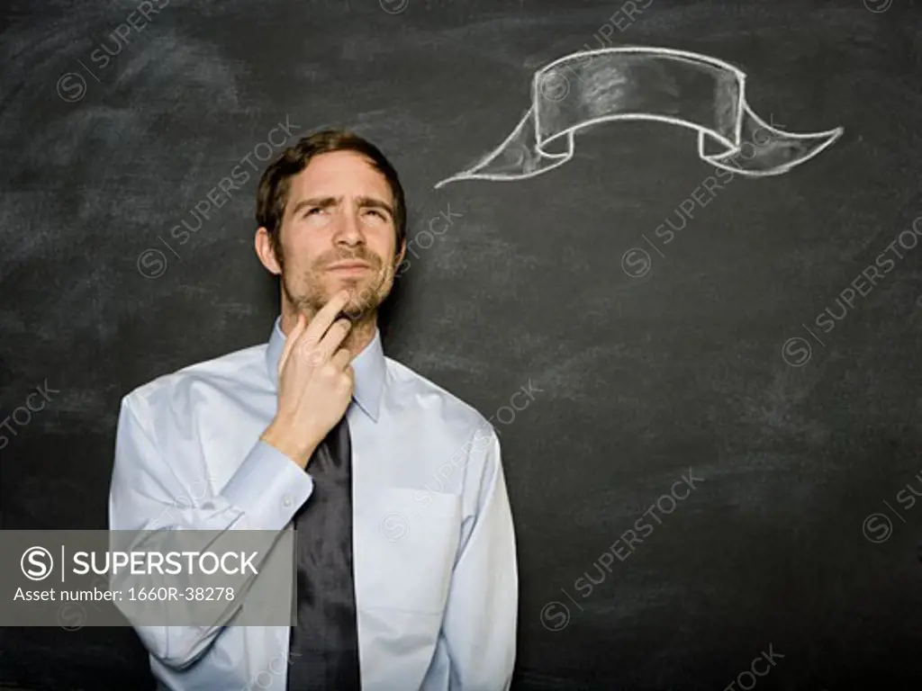 man against a blackboard