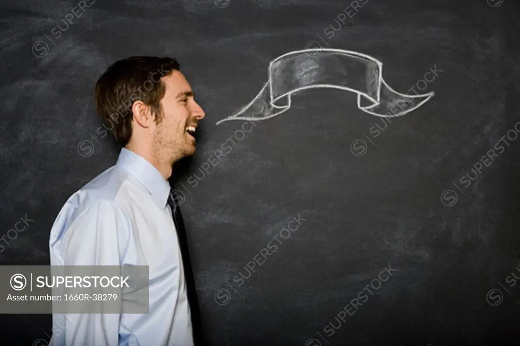 man against a blackboard