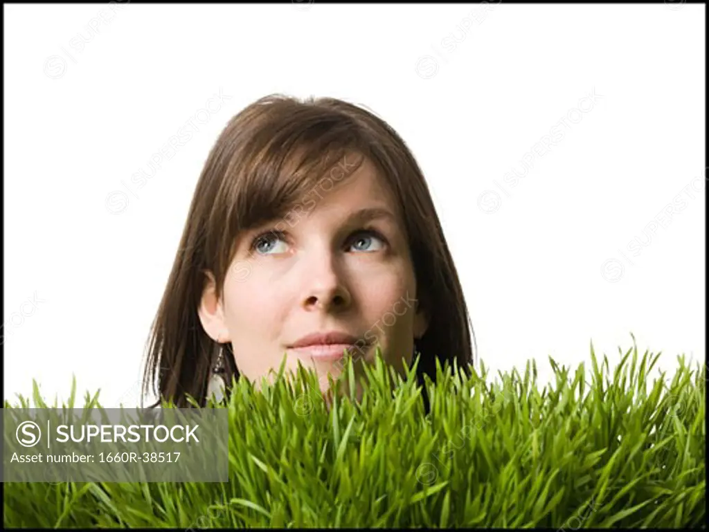 woman's head in the grass