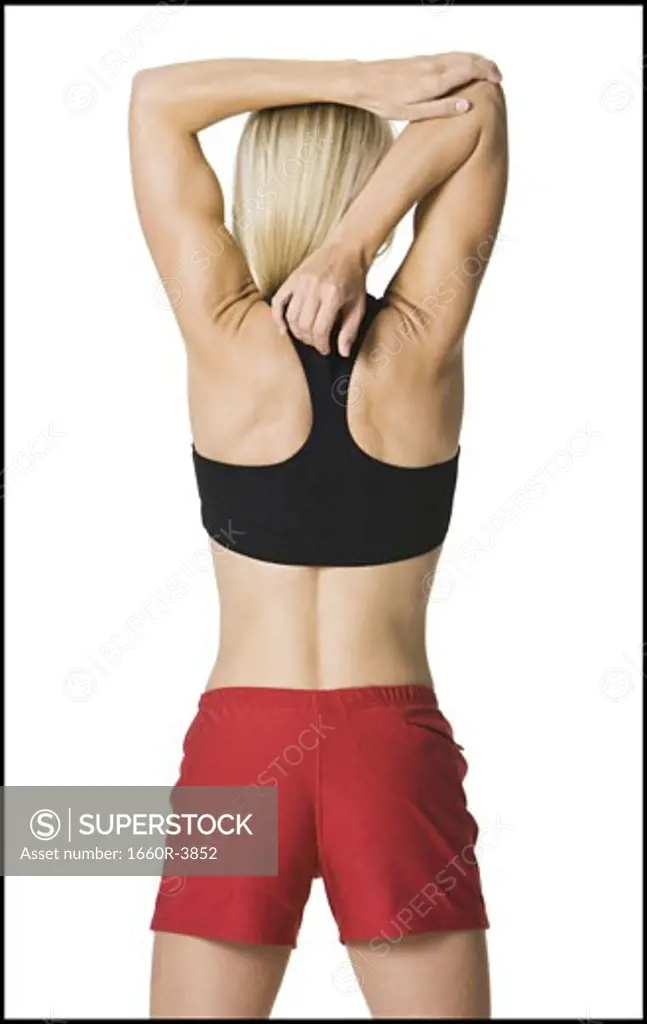 Rear view of a young woman exercising