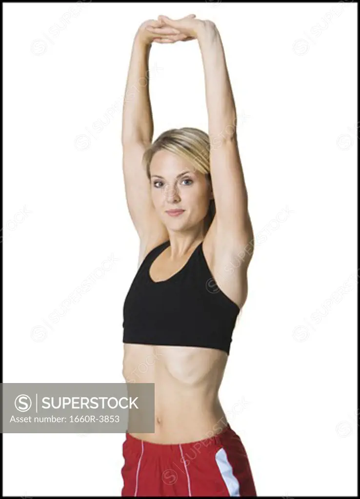 Portrait of a young woman exercising