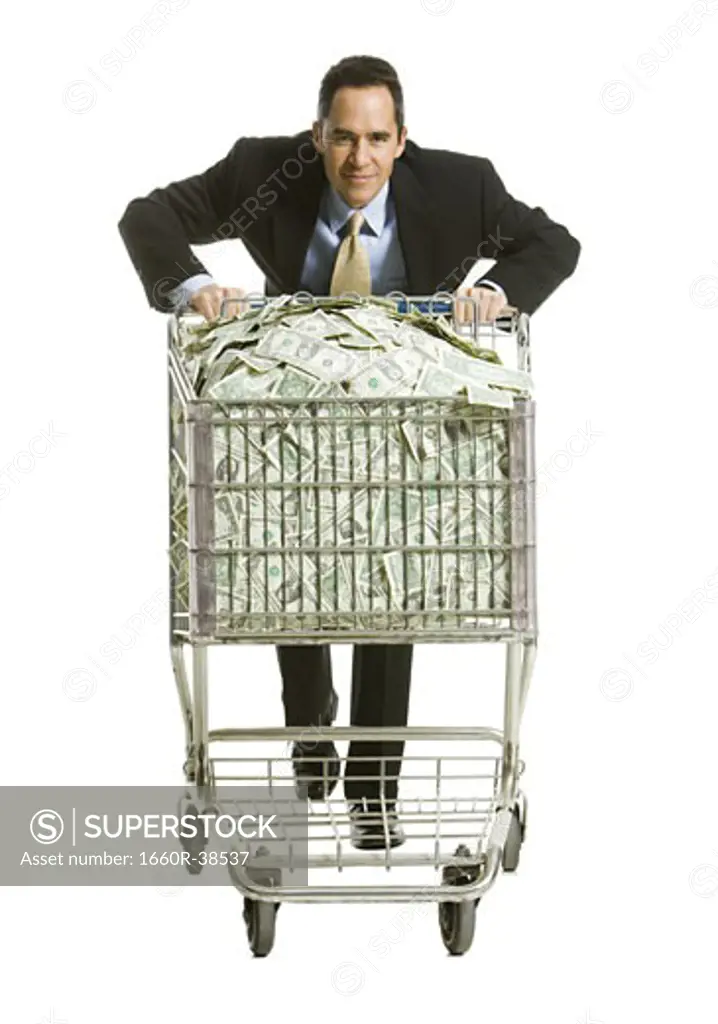 businessperson with a shopping cart full of money