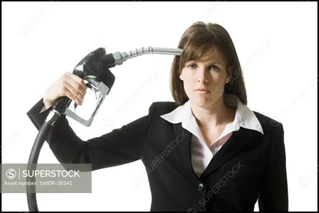 woman holding a gas pump to her head