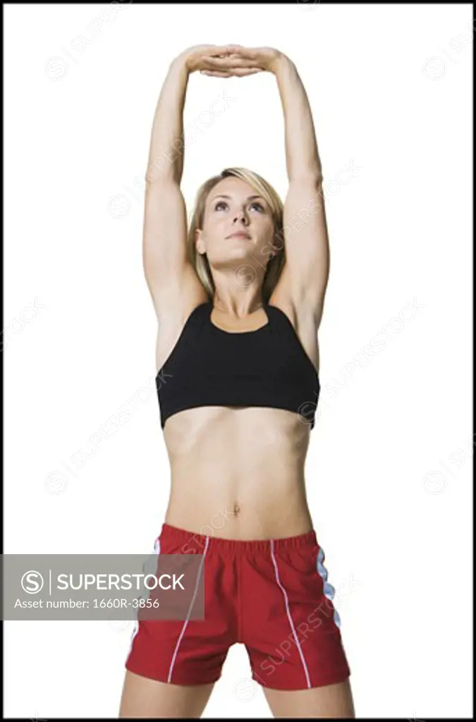 Young woman stretching her arms