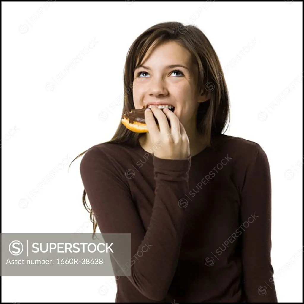 young woman eating junk food