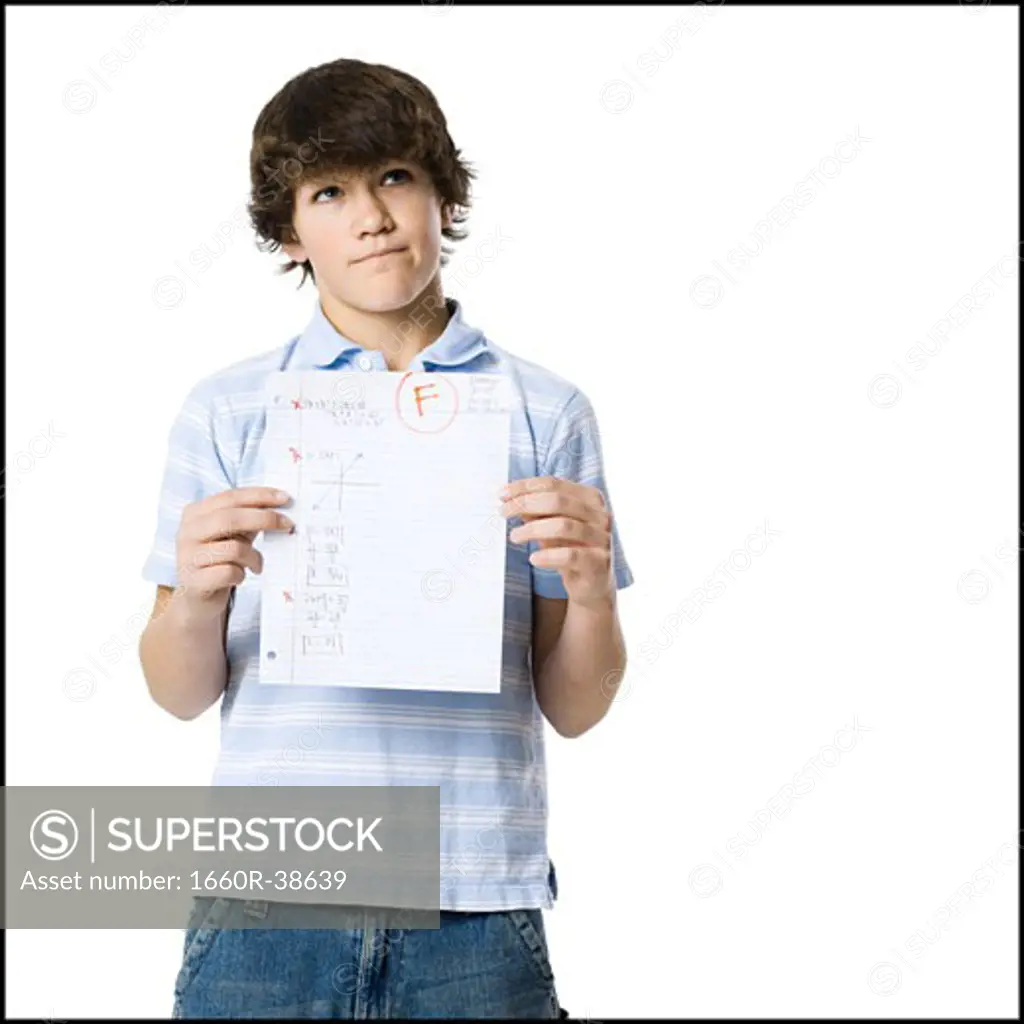 young man showing the grade he received