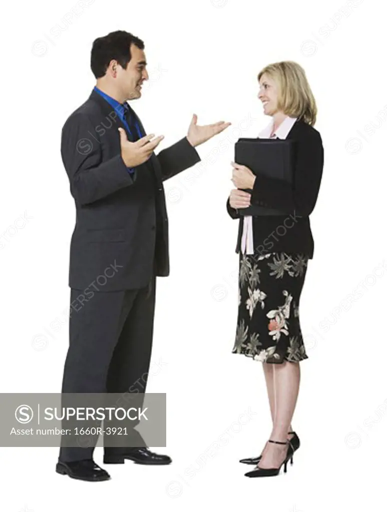 Businessman and a businesswoman talking
