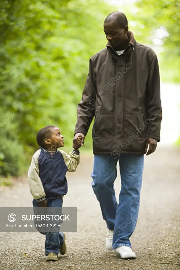 Father walking with his son outdoors