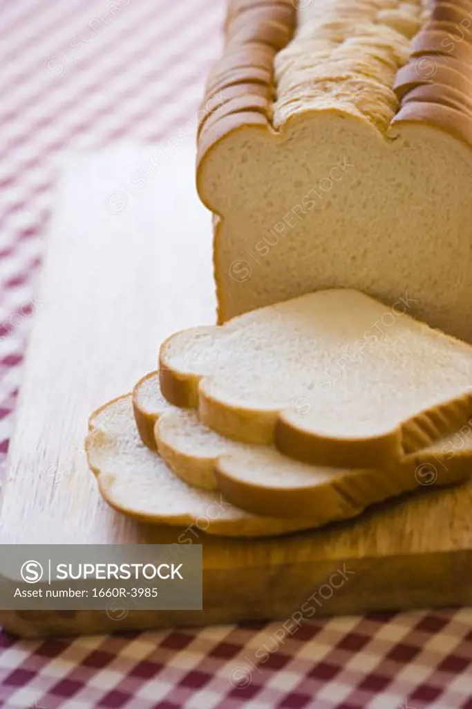 High angle view of bread slices on a cutting board