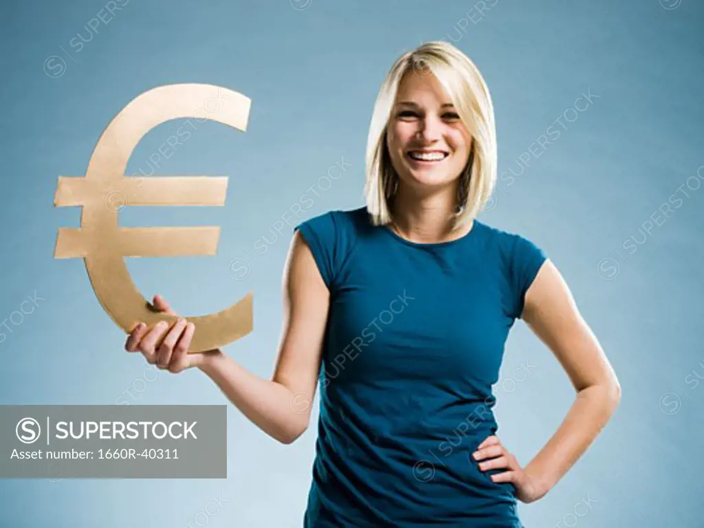 woman holding up a euro symbol