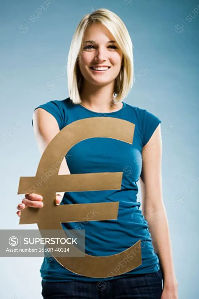 woman holding up a euro symbol