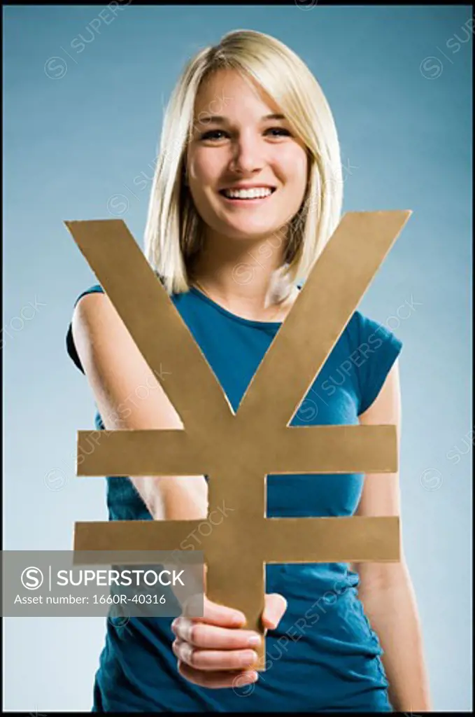 woman holding up a yen symbol