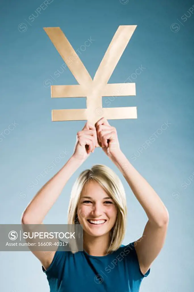 woman holding up a yen symbol