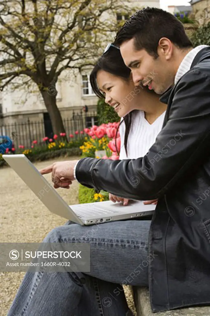 Young couple working on a laptop