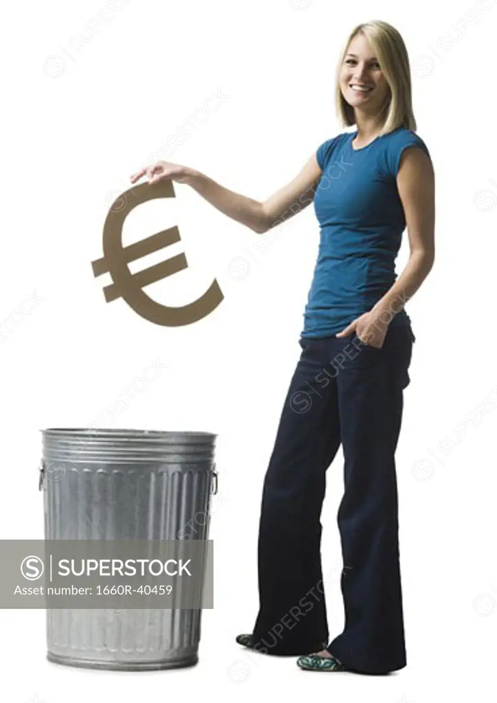 woman throwing euro symbol in the trash
