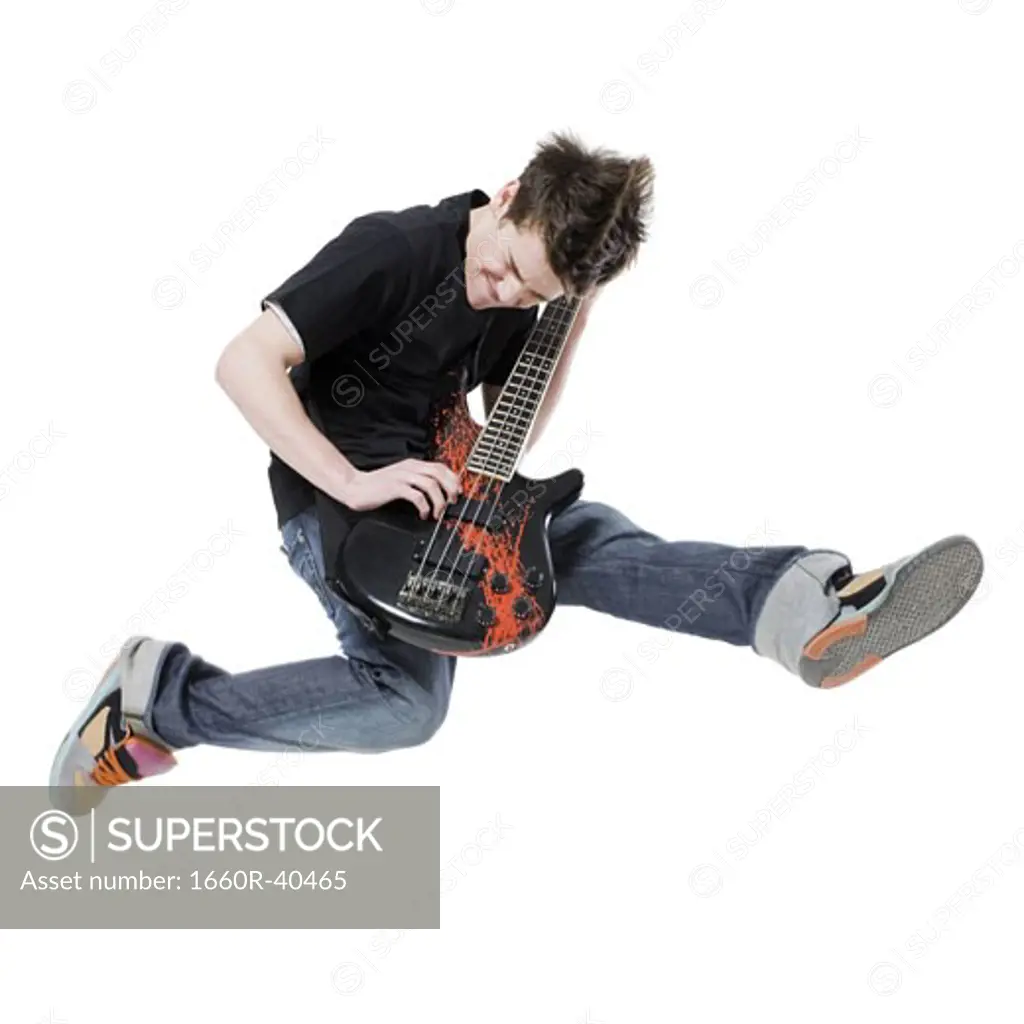 teenager with an electric guitar