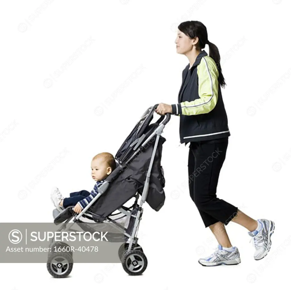 woman pushing her baby in a stroller