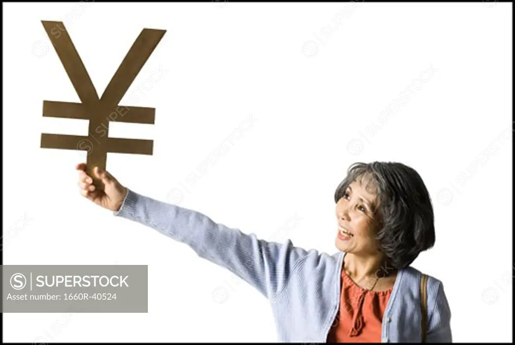 woman holding currency symbol