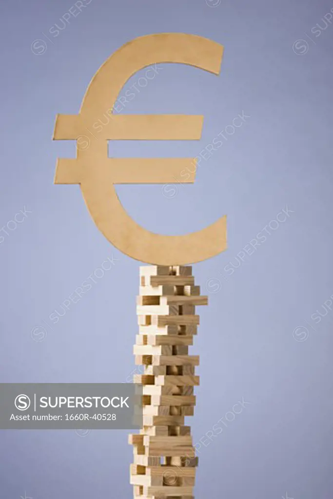 currency symbol on a tower of blocks
