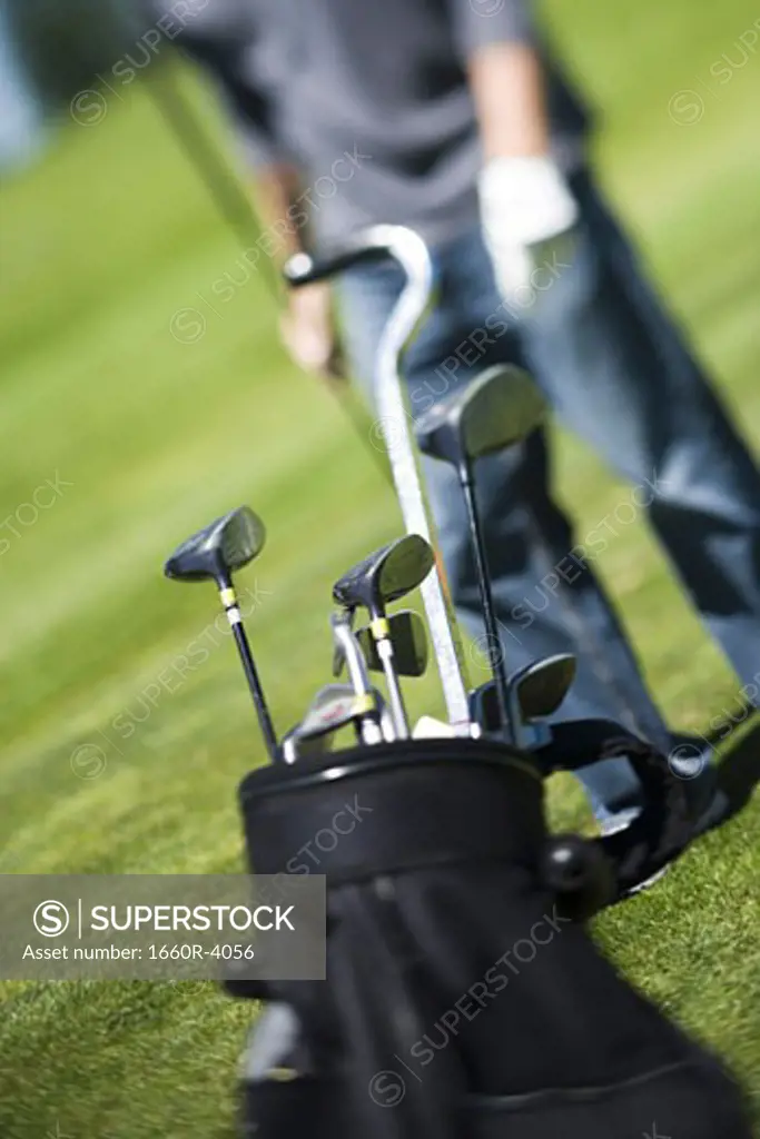 Close-up of golf clubs in a golf bag