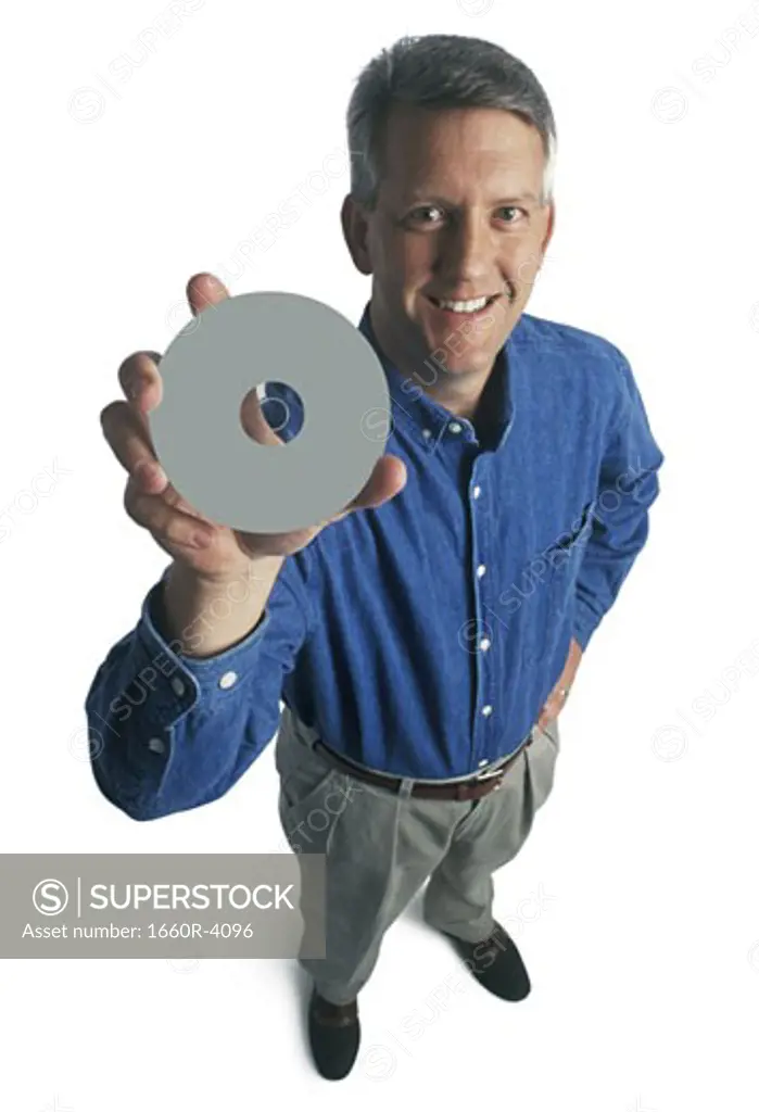 Portrait of a man holding a compact disc