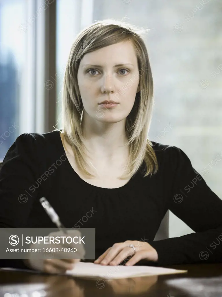 woman taking notes