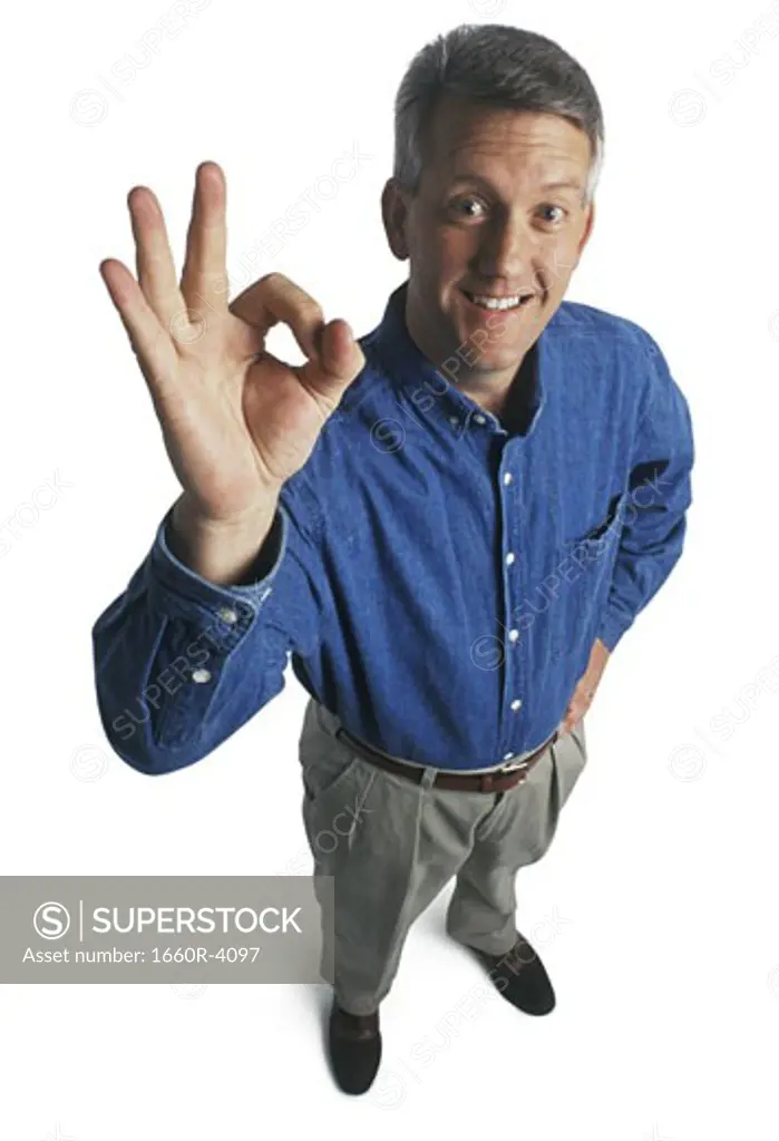 Portrait of a man giving the OK sign