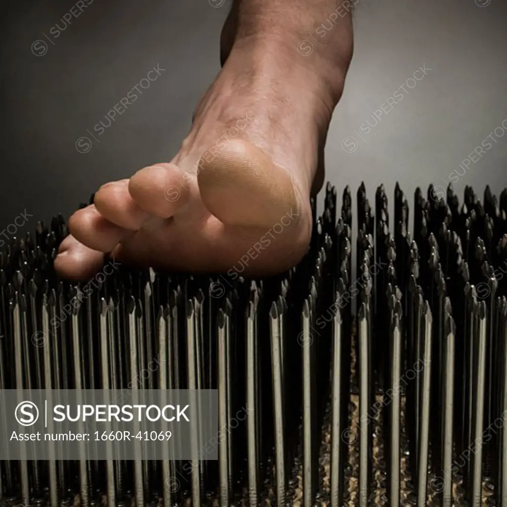 foot walking on nails