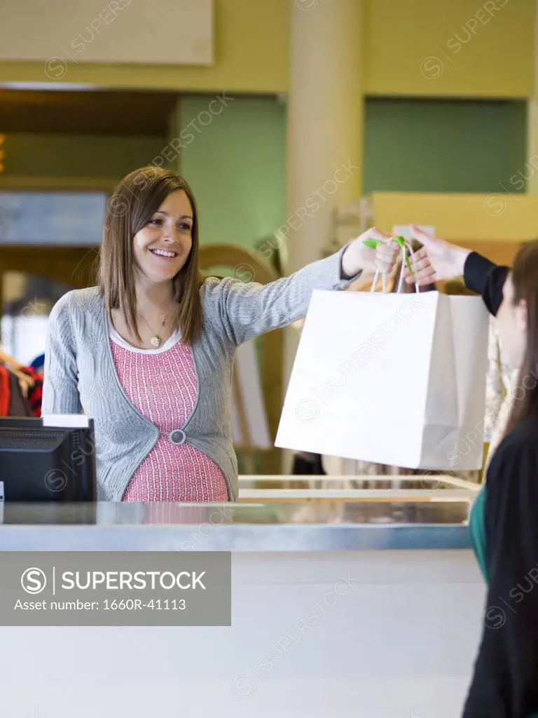 pregnant clothing store clerk