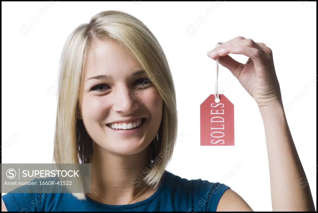 woman holding sale tag