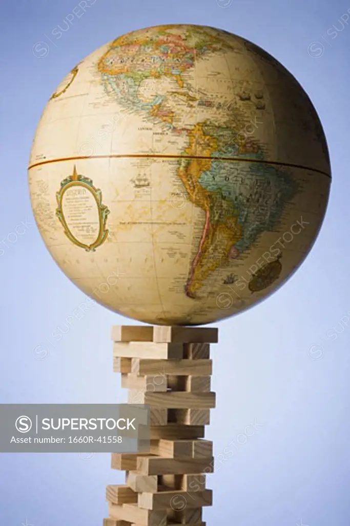 globe on a tower of blocks