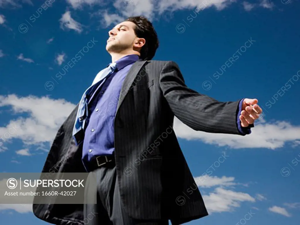 businessman with arms outstretched