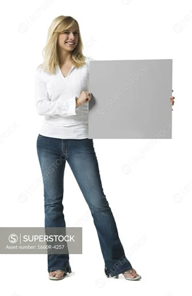 Portrait of a young woman holding a blank sign