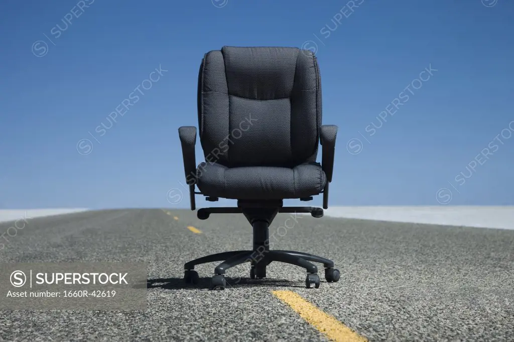 office chair in the middle of the road