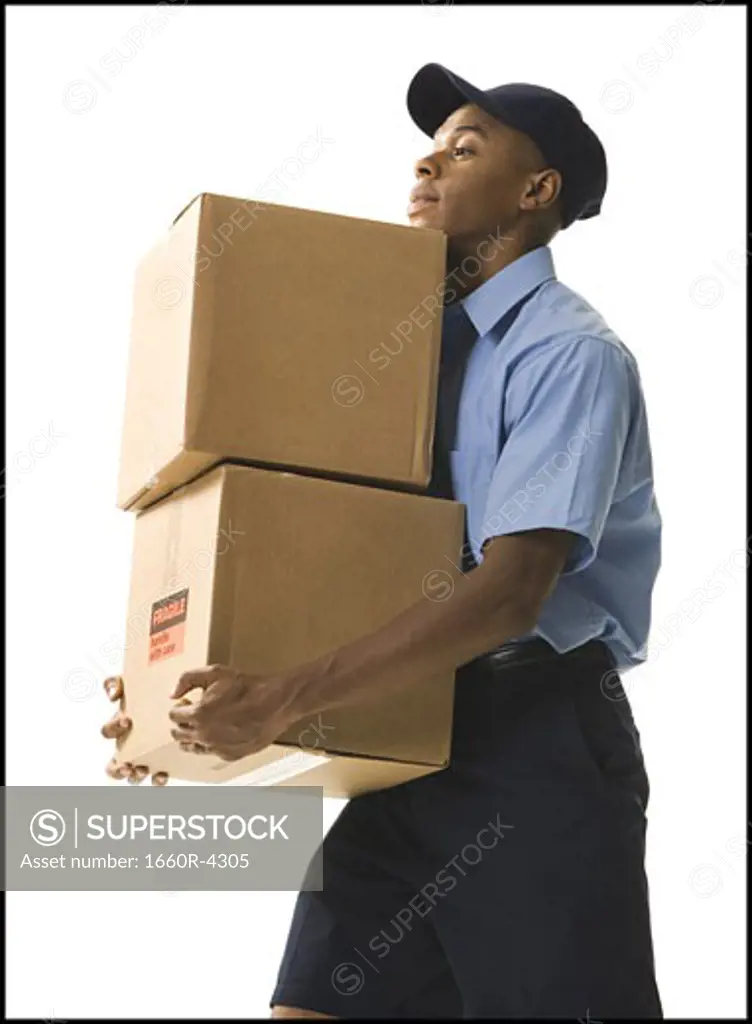 Profile of a young man carrying cardboard boxes