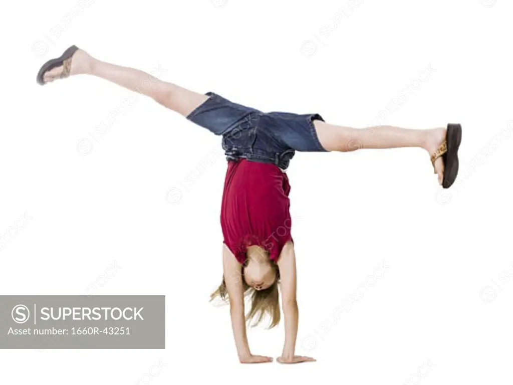 girl doing a hand stand