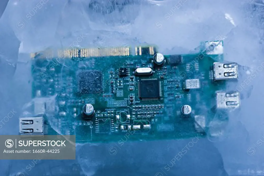 computer chip frozen in a block of solid ice
