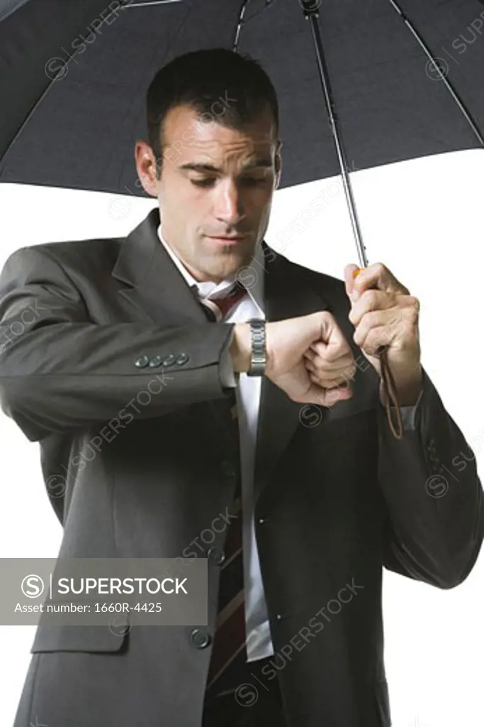 Businessman looking at his wristwatch