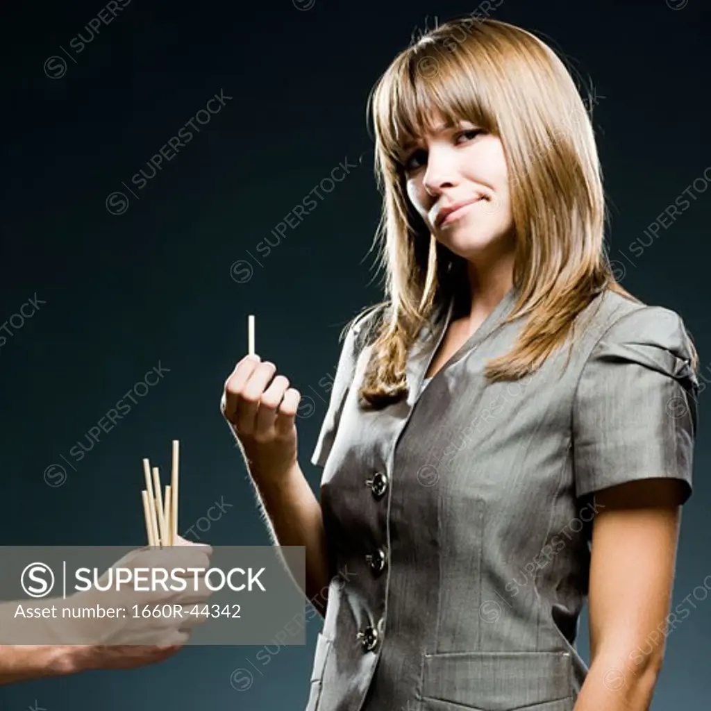 businesswoman drawing straws