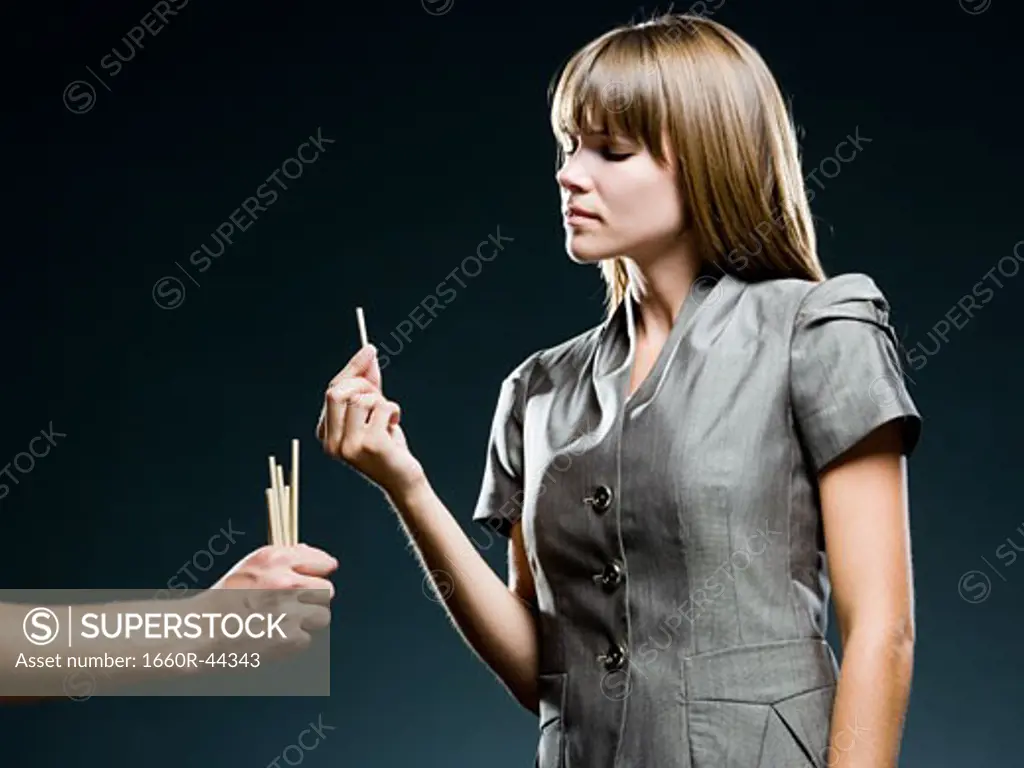 businesswoman drawing straws