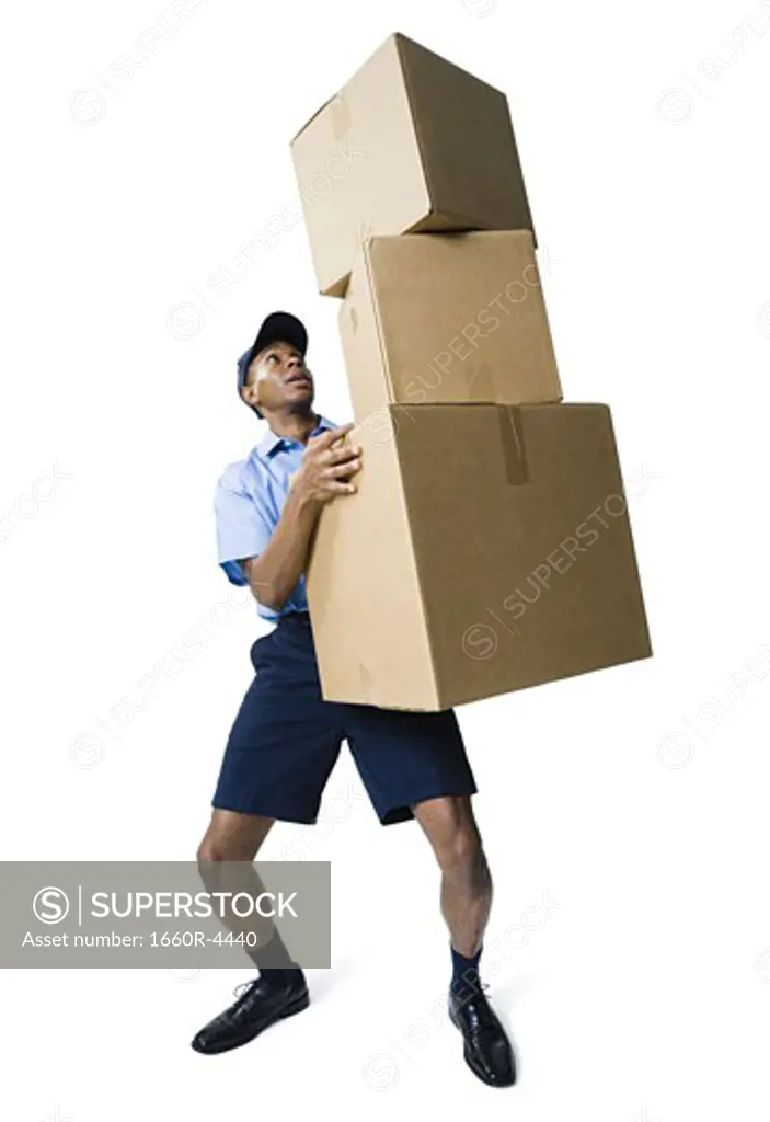 Delivery man holding a stack of boxes