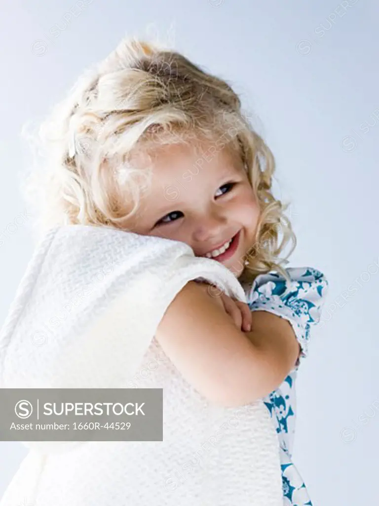 little girl holding her blanket