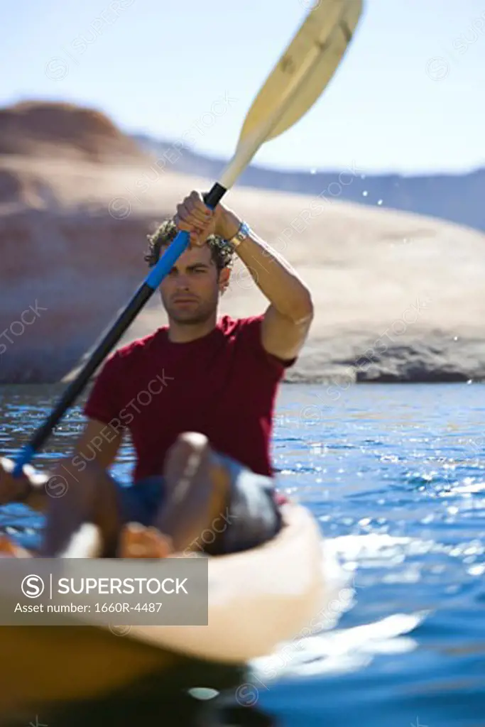 A young man kayaking