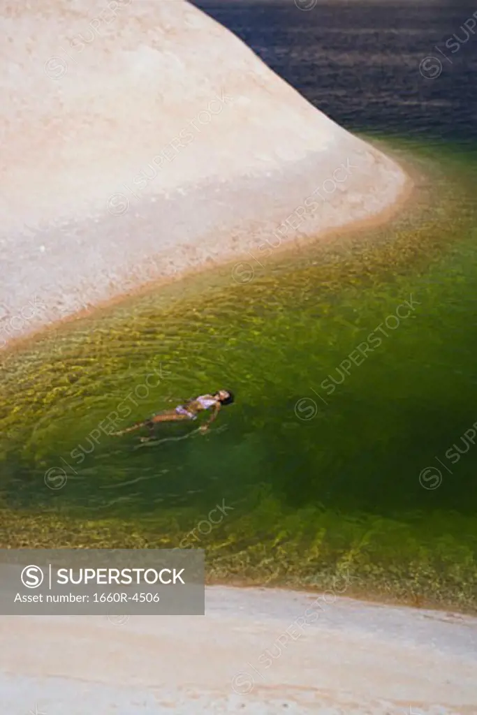 High angle view of a young woman swimming