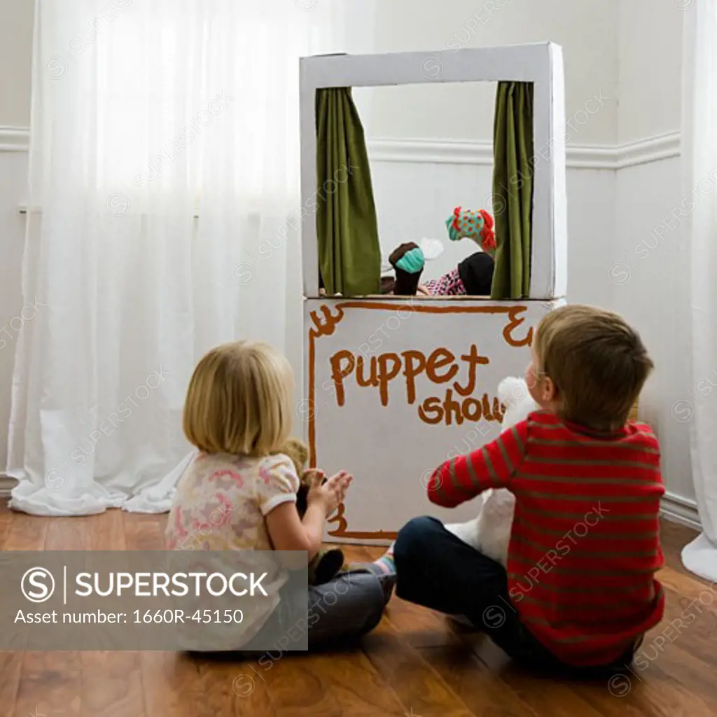 children watching a puppet show