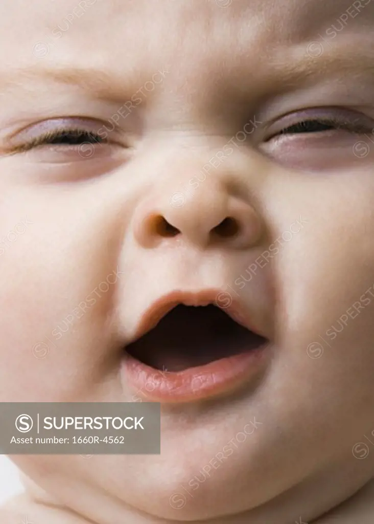 Close-up of a baby girl yawning