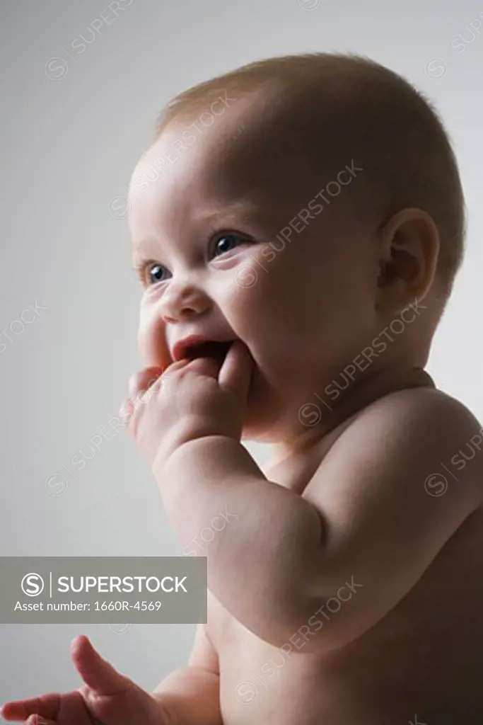 Profile of a baby girl smiling